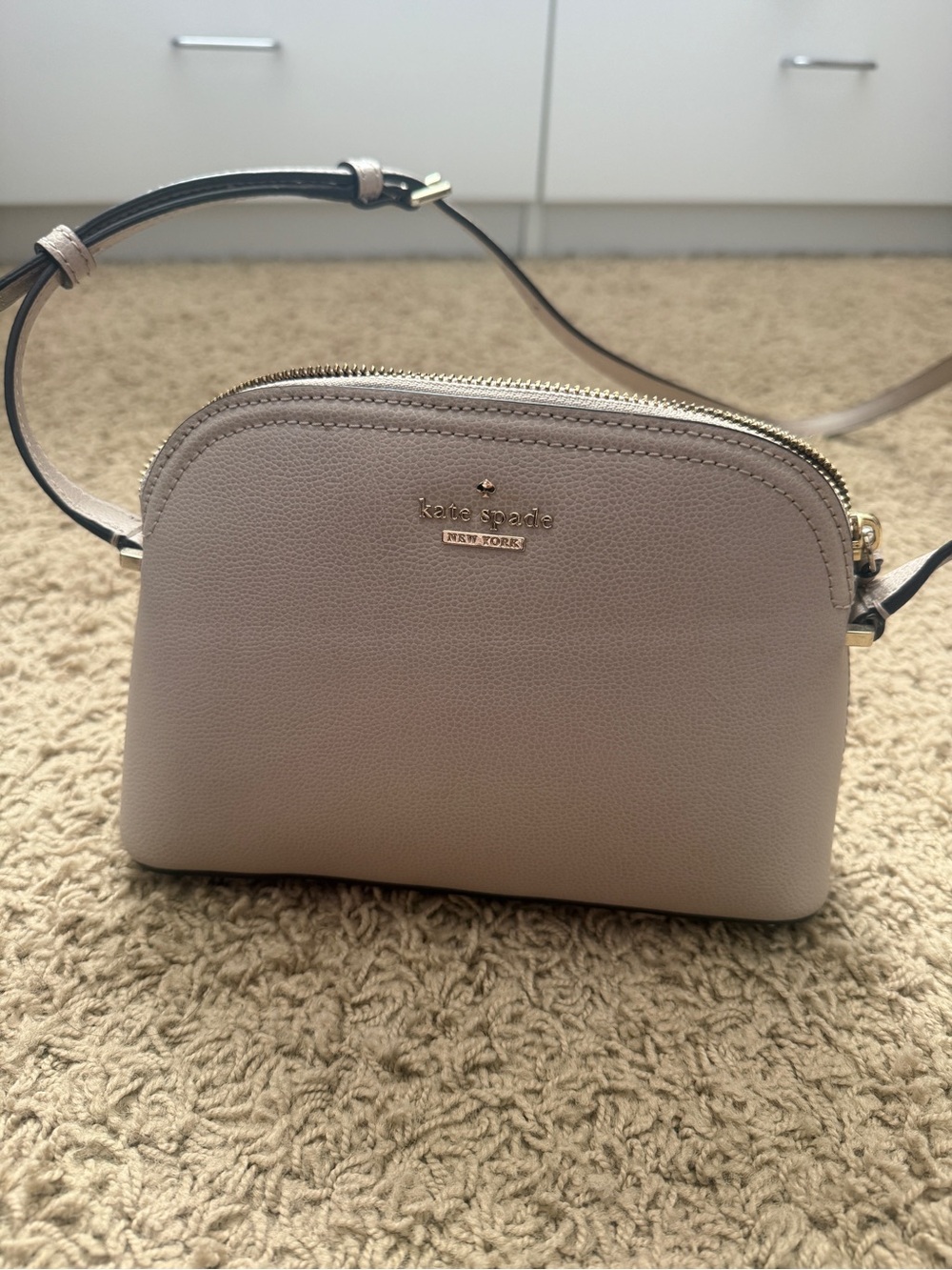 kate spade pebble leather dome crossbody in light taupe